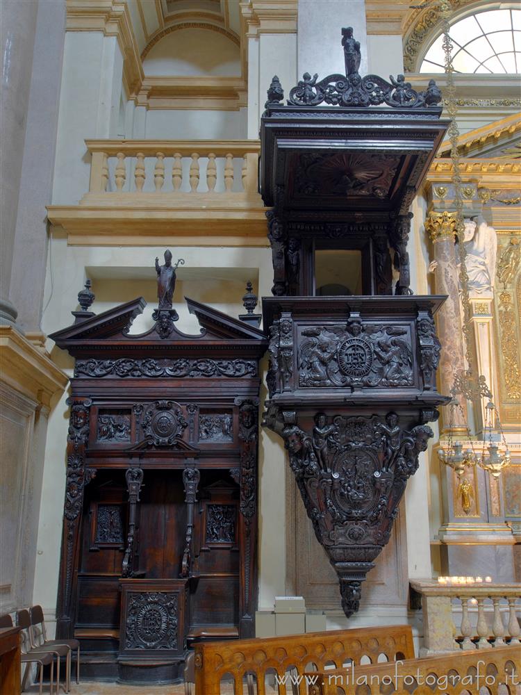 Milan (Italy) - A confessional and the pulpit of the Church of San Fedele